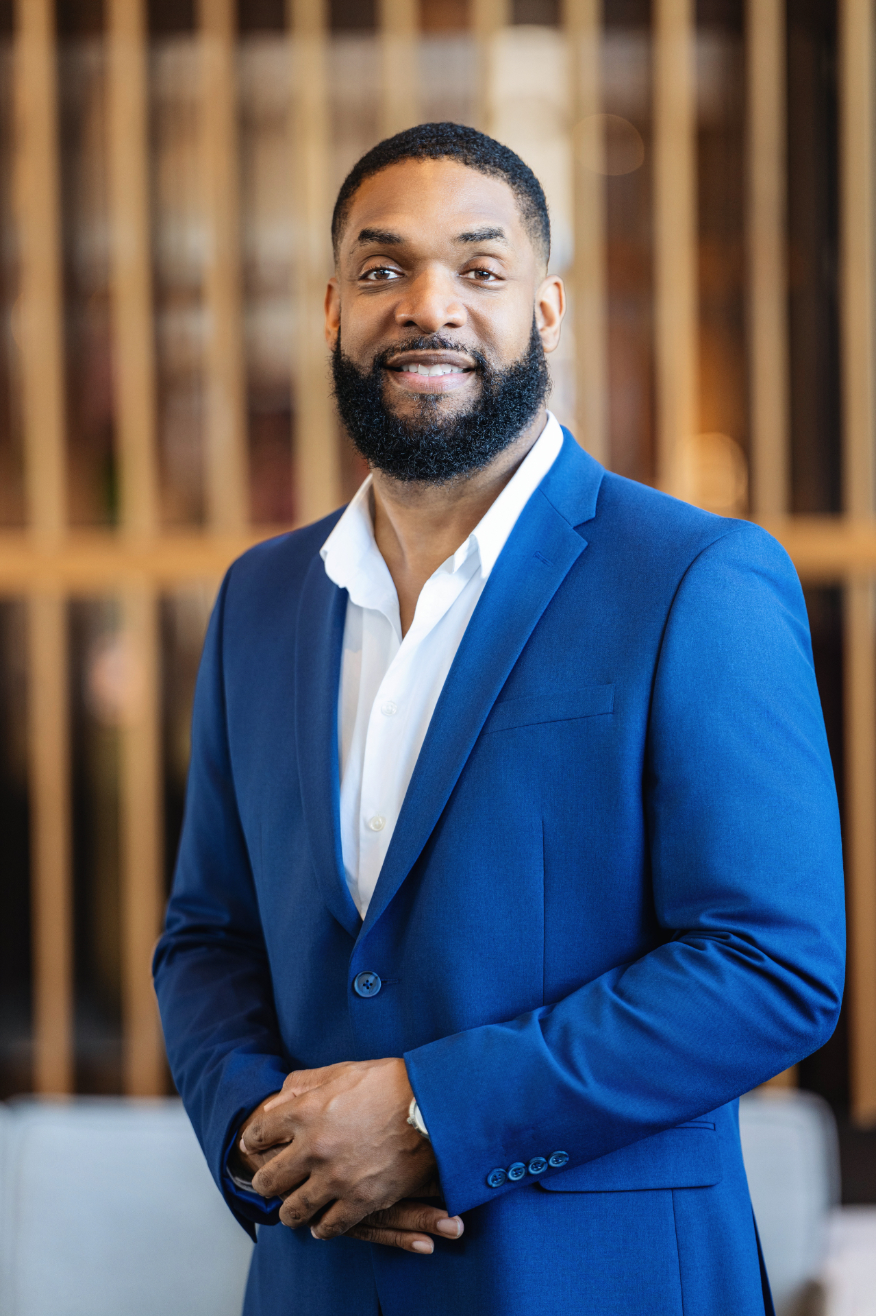 Portrait of Jay Cameron in a blue suit