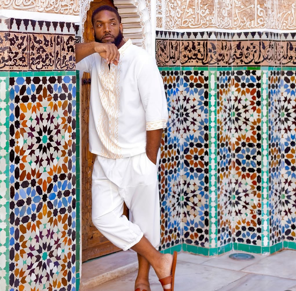 Jay Cameron leaning against a tiled Moroccan doorway